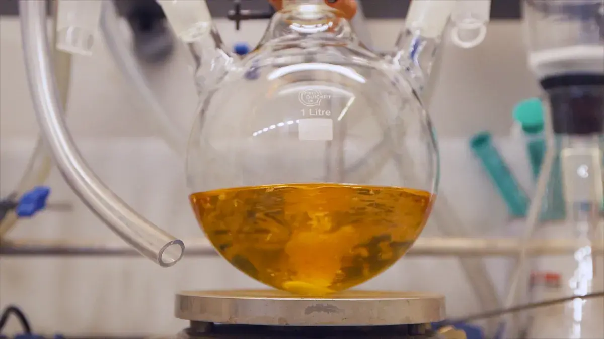 Orange Polymer in Flask