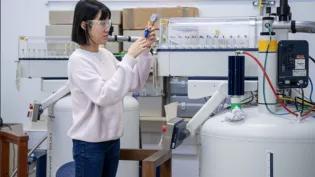 Scientist at NMR Machine