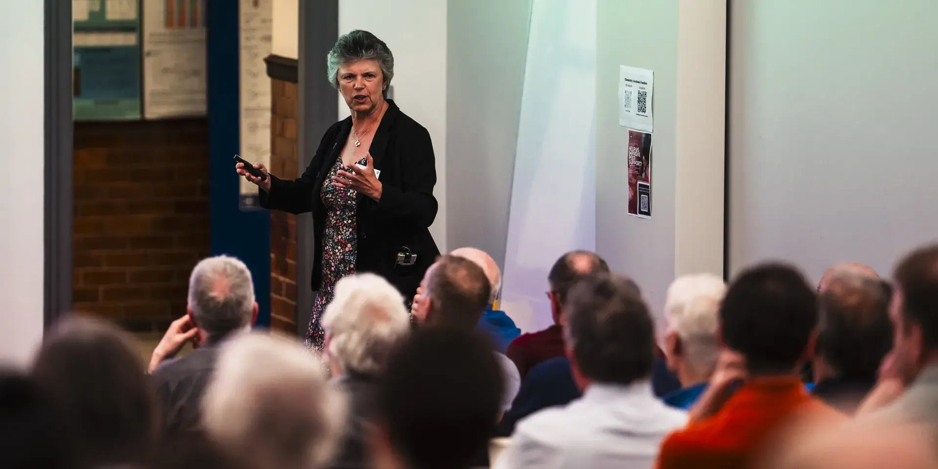 Professor Gill Reid giving a presentation to an audience