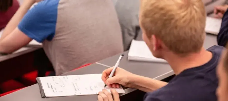 Student taking notes