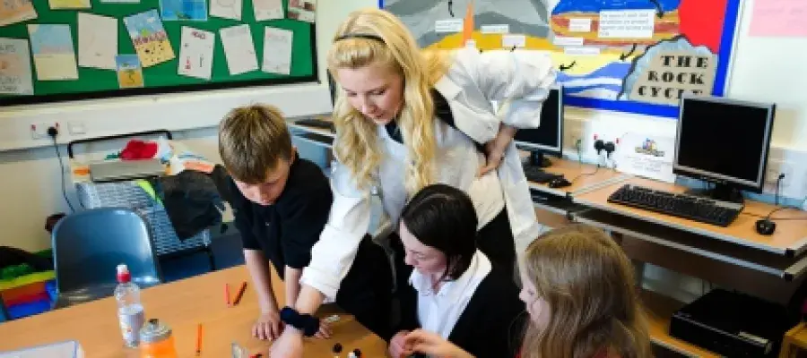 Scientist in a classroom with kids