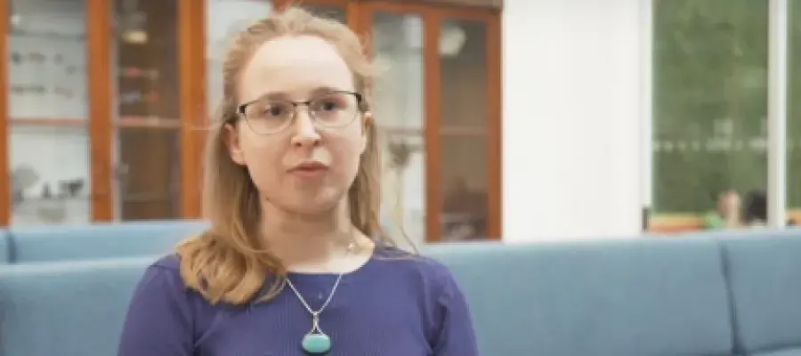A student sitting on a couch