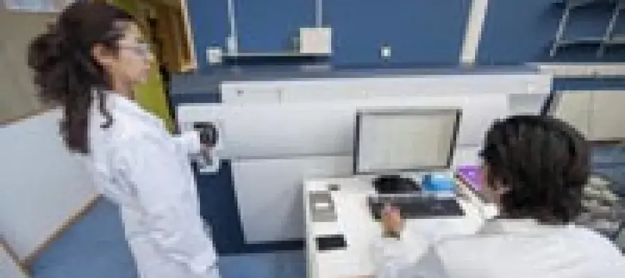 Students using a scientific instrument