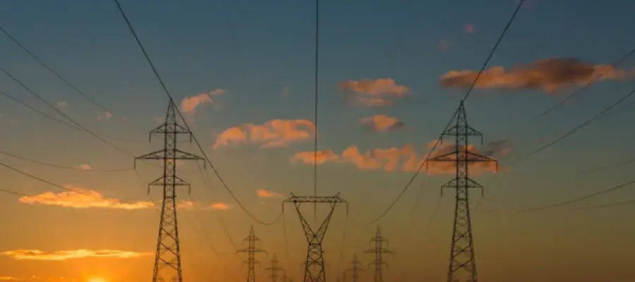 electricity pylons at sunset