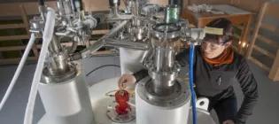 A researcher using an NMR machine