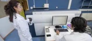 Students using a scientific instrument