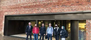 The group outside the distillery