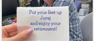 Juraj Bella with a message wishing him a happy retirement