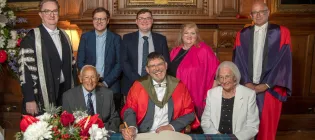 Group photo of Bissell family and University colleagues