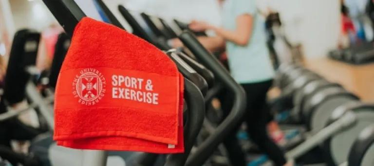 A towel hanging on an exercise bike
