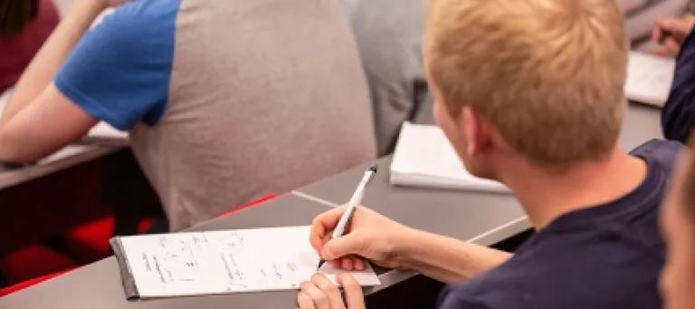 Student taking notes