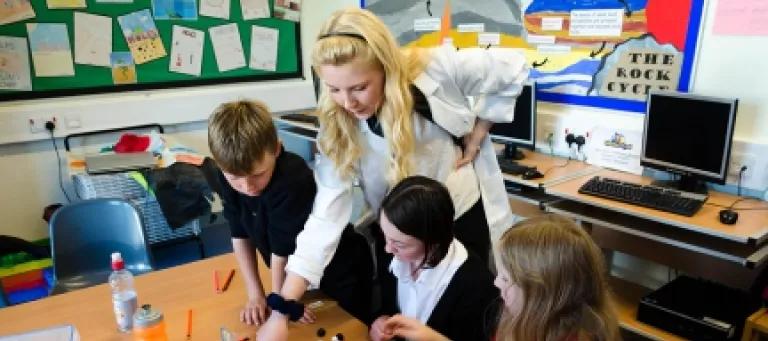 Scientist in a classroom with kids