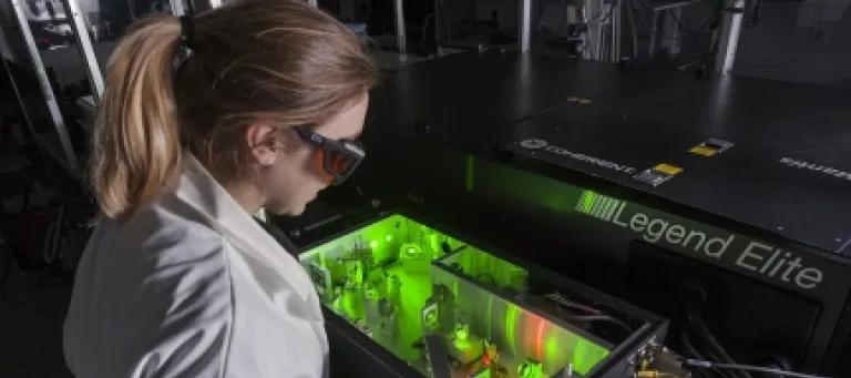 A student using a laser
