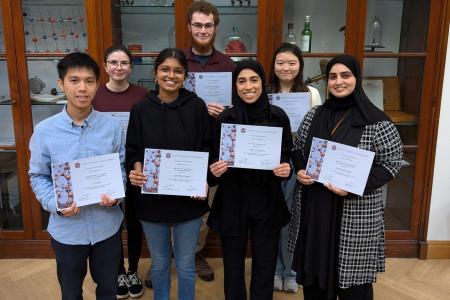 Image of PGT student award winners with certificates