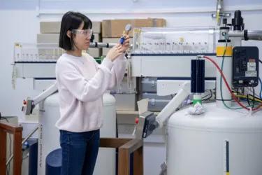 Scientist at NMR Machine