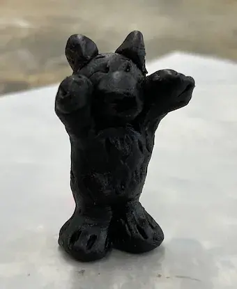 Reclaimed metal sculpture of a cat