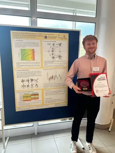Harvey presenting his poster