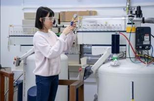 Scientist at NMR Machine